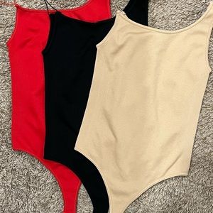 Dynamic Seamless Apparel Bundle Of 3 Ribbed Bodysuits One Size Black Red Nude